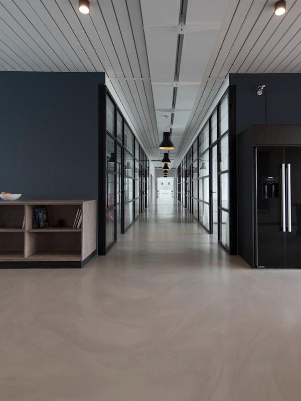 Modern corporate office interior with professionals at work